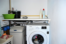 utility room with washing machine and water purification system